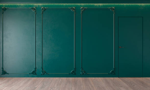 istock Modern classic green interior with stucco, door, wooden floor, ceiling backlit, molding. Empty room, blank wall. 1129798517
