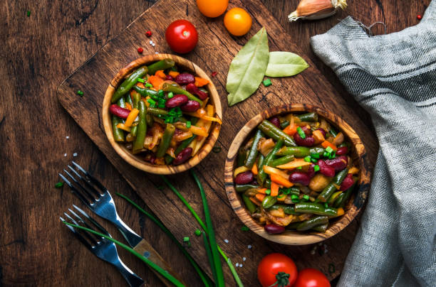 green beans with roots, vegetables, mushrooms, spices and tomatoes, vegan bowls. food cooking background, vintage wooden rustic table. view from above - fungus roots imagens e fotografias de stock