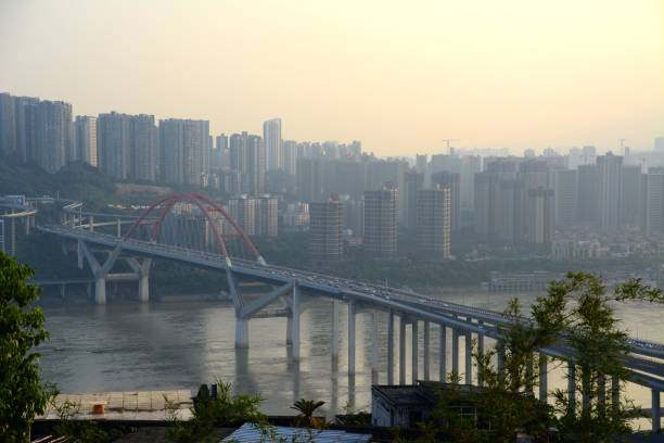 istock Chongqing and Caiyuanba bridge at sunset, China 1129802456