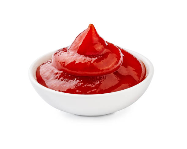 istock Ketchup in bowl isolated on white background. 1129803354