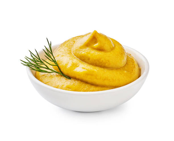 istock Yellow mustard with green dill isolated. 1129803392
