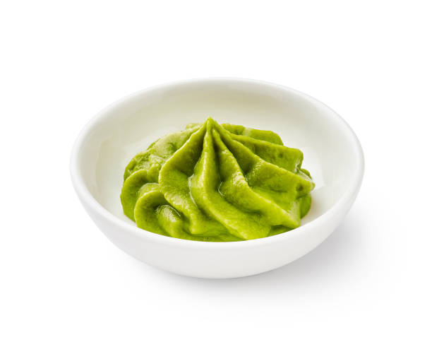 istock Wasabi in bowl isolated on white background 1129803405
