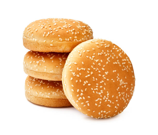 istock Four Hamburger buns with sesame isolated on white background 1129803482