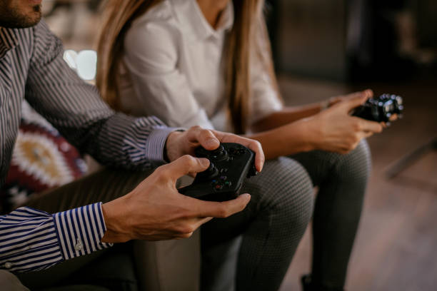 istock Happy couple playing video games 1129805940
