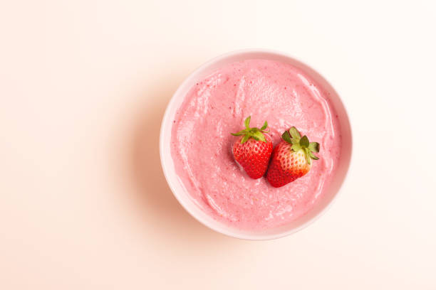 istock Smoothie bowl on yellow background 1129806194