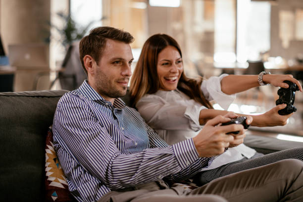 istock Couple playing video games 1129806490