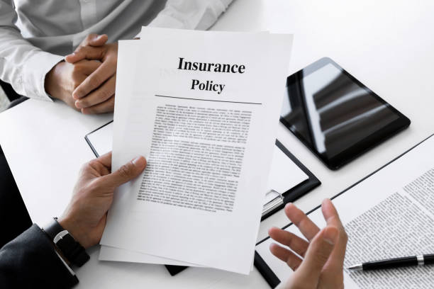 istock Insurance agent explain consulting with customer to signing the policy form. 1129807926
