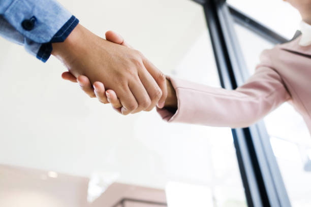 istock business partner hands shaking about agreement license 1129807937