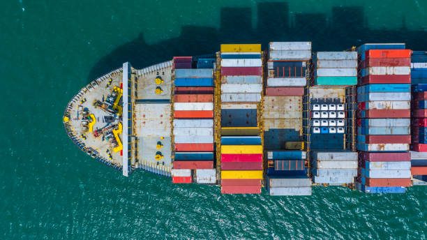 istock Container ship arriving in port, container ship going to deep sea port, logistic business import export shipping and transportation, Aerial view. 1129809529