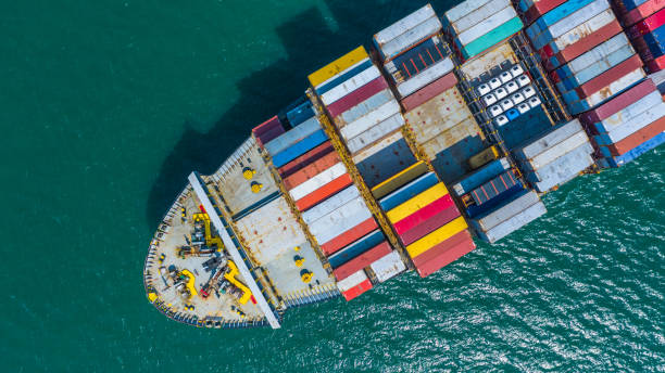 istock Container ship arriving in port, container ship going to deep sea port, logistic business import export shipping and transportation, Aerial view. 1129809561