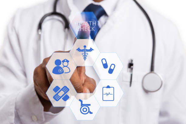 istock Male doctor using finger to choose health check button 1129809799
