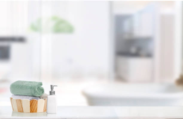 istock Wooden bath bucket with towels on white table. 1129810492