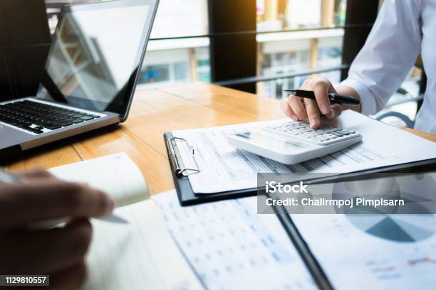 Business Audits Using A Calculator Financial Data Investment Fund At A Workplace Wealth Concept Stock Photo - Download Image Now