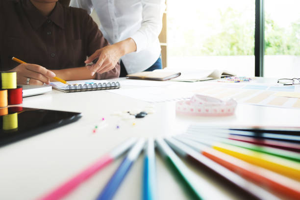 istock group of young creative fashion designers working hard on project at a studio 1129810842