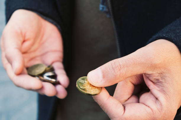istock man with some czech koruna coins in his hands 1129810995