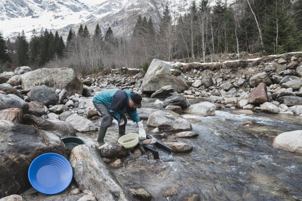 istock Adventures on river. Alluvial gold prospector. Moody instagram effect 1129811019