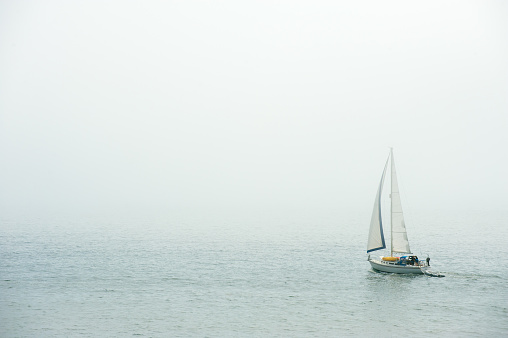yachts on the pier in the fog