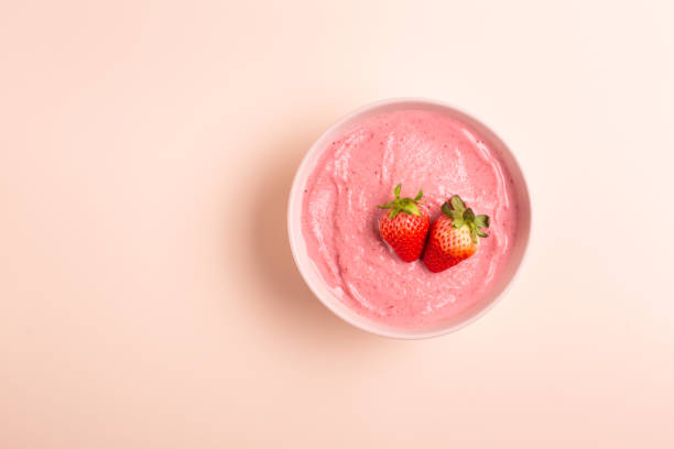 Smoothie bowl on yellow background
