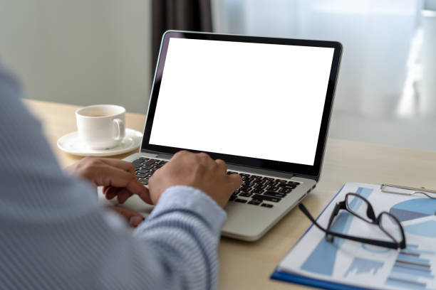 istock Mockup of business man using  laptop screen for your advertising text message 1129813903