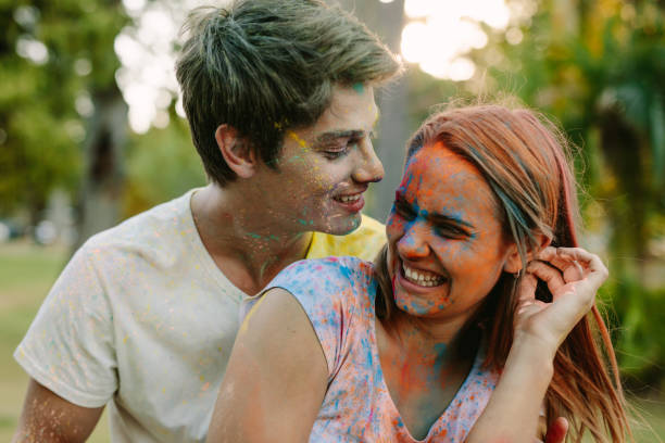 istock Couple playing holi outdoors 1129814466