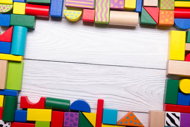 istock Kids educational developing toys frame on white background. Top view. Flat lay. Copy space for text 1129814829
