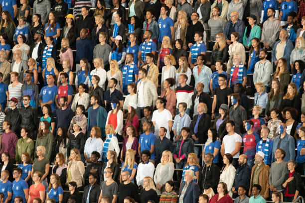 istock Spectators watching football match 1129816133