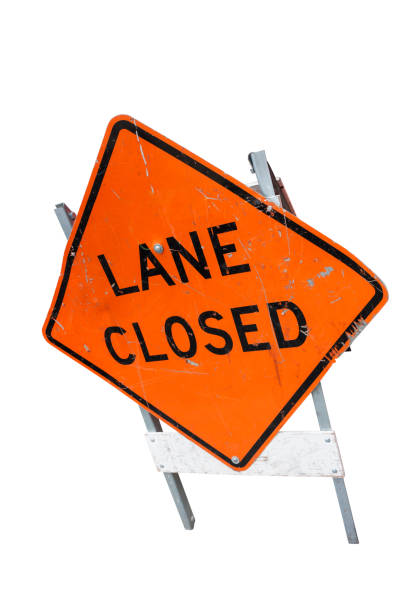 istock lane closed road sign isolated on white 1129818558