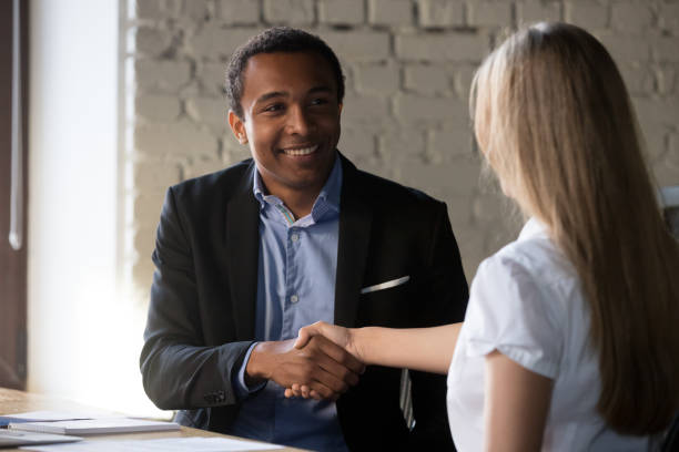 istock Excited partners handshake after successful interview in office 1129819909