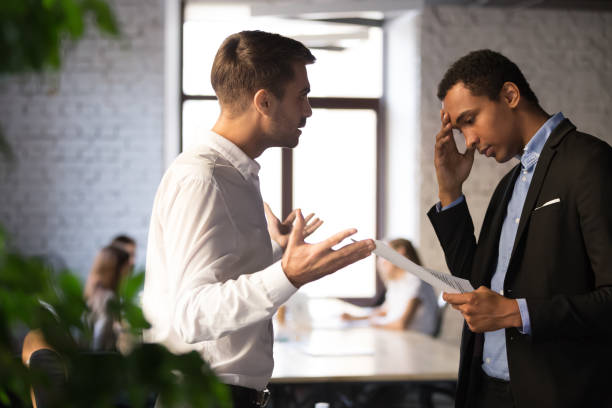 istock Mad boss lecture employee for bad financial report 1129819947