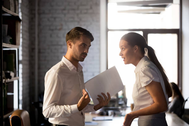 istock Diverse employees argue over financial report in office 1129819963