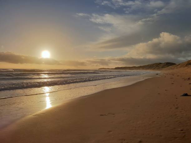 istock Sunrise over sea and dunes 1129821434