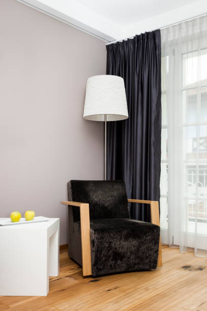 istock room with lamp and chair 1129821995