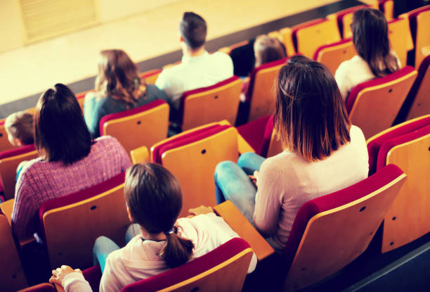 istock Ordinary audience expecting movie to begin 1129822237