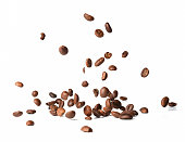 Falling roasted coffee beans. Chaotic motion.