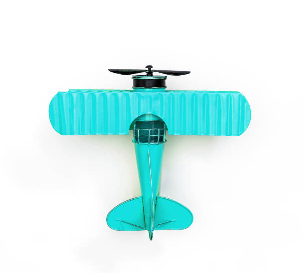 istock teal Metal toy plane isolated on white 1129827182