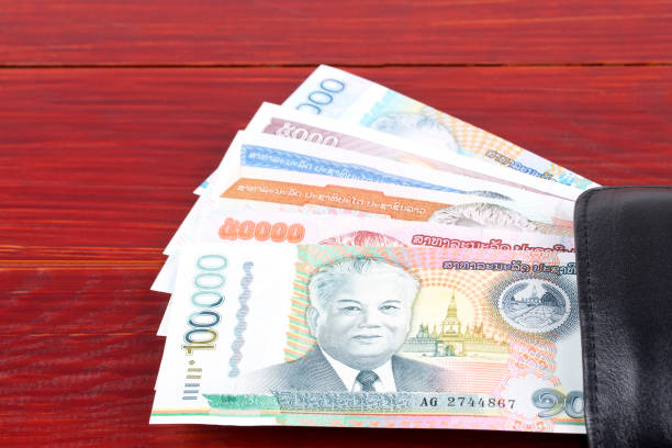 istock Money from Laos in the black wallet 1129829711