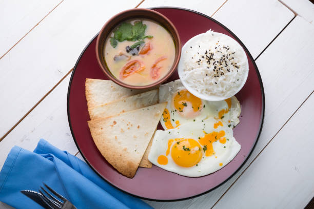 istock Asian breakfast of rice, soup and fried eggs 1129831200