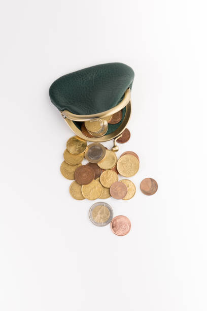istock small leather wallet with coins  isolated on white background, top view 1129831807