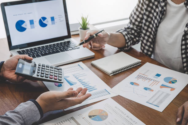 istock Business team casual collaboration discussing working analysis with financial data and marketing growth report graph in team, Meeting Talking Brainstorming Communication Concept 1129832790