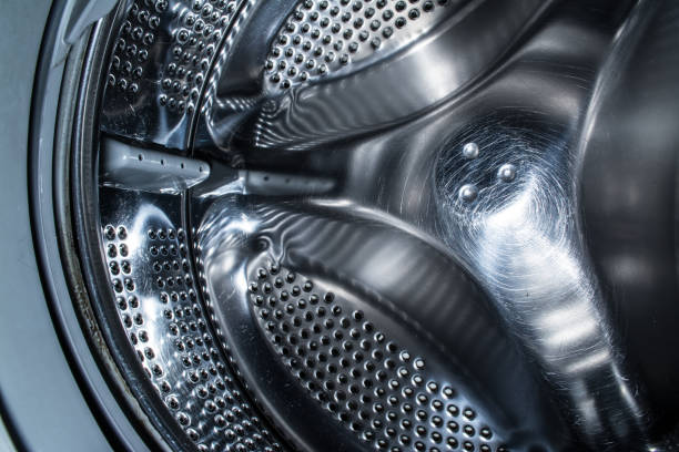 istock Clean drum of a modern washing machine close up. 1129836825