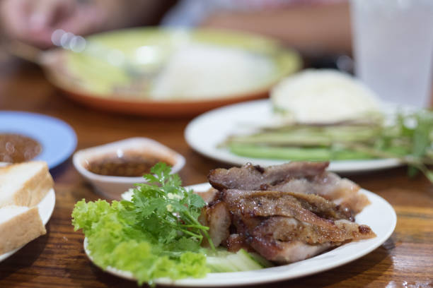 istock Tasty slice grilled beef on white dish in Thai restaurant 1129839733
