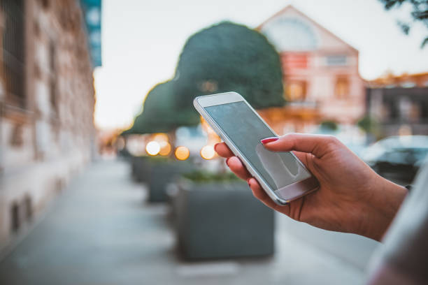 istock Young cute woman using phone 1129840130