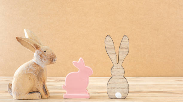 istock A clay bunny, a ceramic bunny and a wooden bunny 1129840501