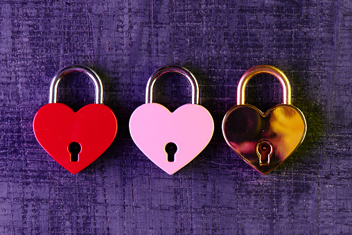 Three locks in the shape of a heart. Love concept Valentine's Day