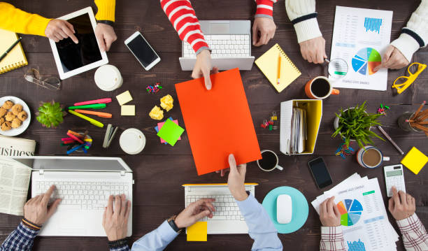 Group of Business People Working on an Office Desk\