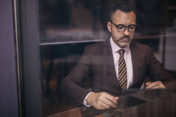 istock Businessman with eyeglasses 1129847440