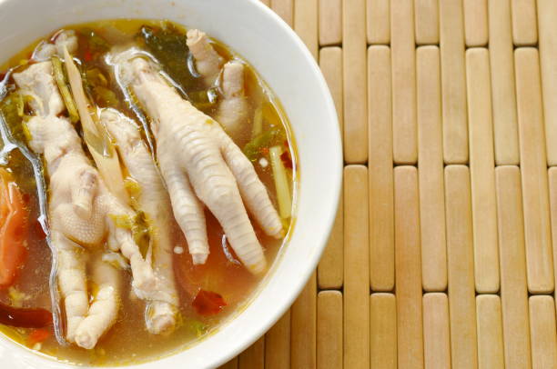 istock spicy chicken feet with tom yum soup 1129847515