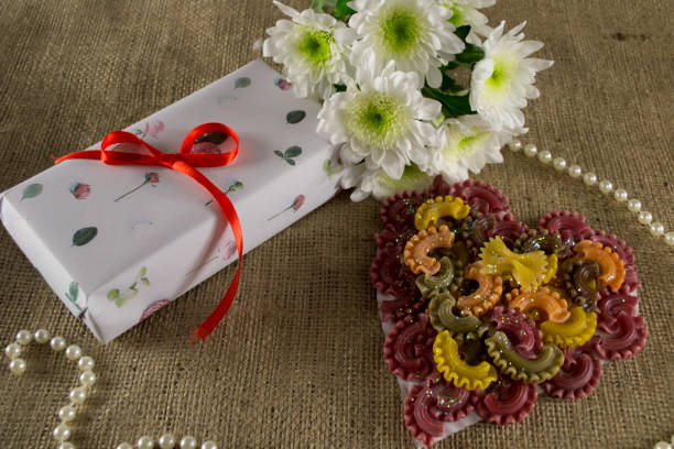 istock postcard of pasta with flowers 1129851063