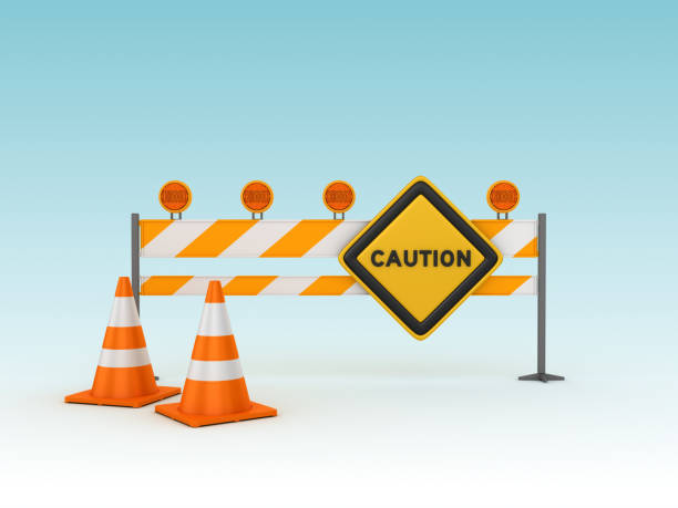 istock CAUTION Road Sign with Barrier and Cones - 3D Rendering 1129851761