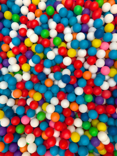 istock Top view colorful plastic balls in a kid playground pool. 1129854921